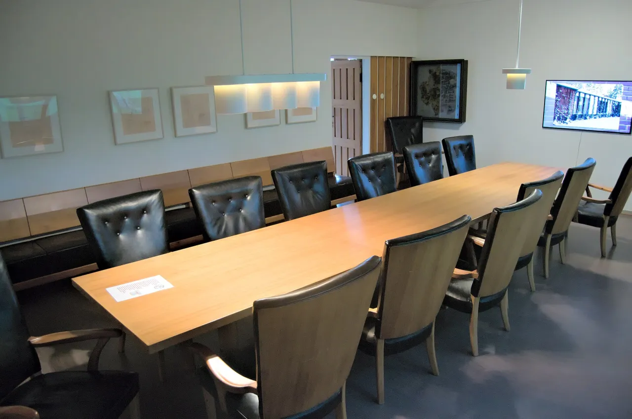 Meeting room with a table and chairs
