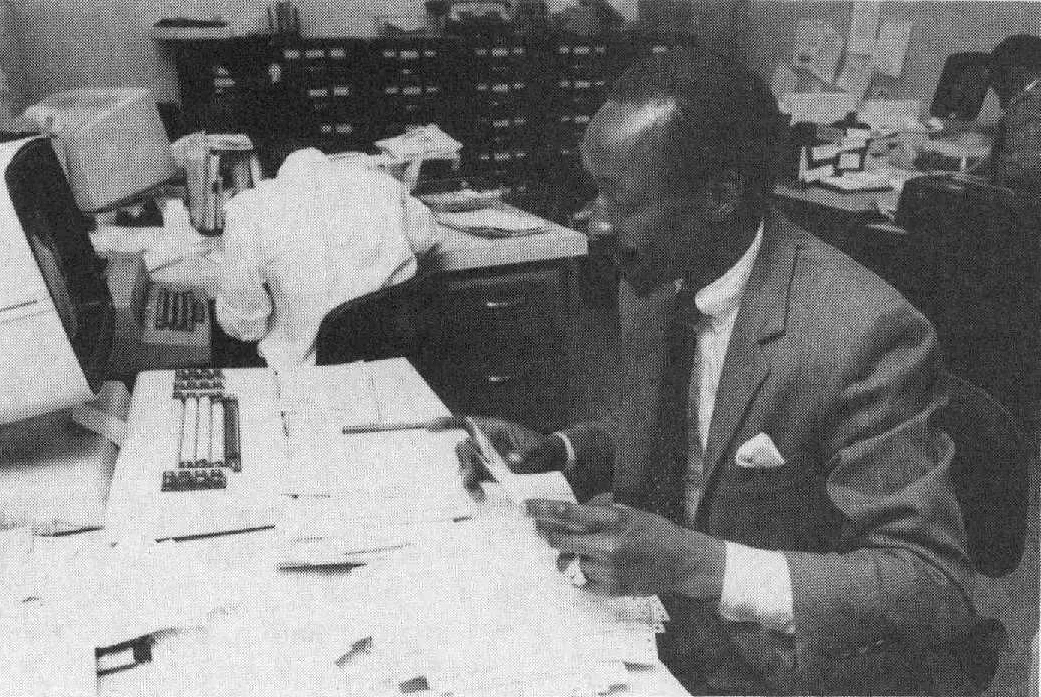 Office clerk working with records in an office
