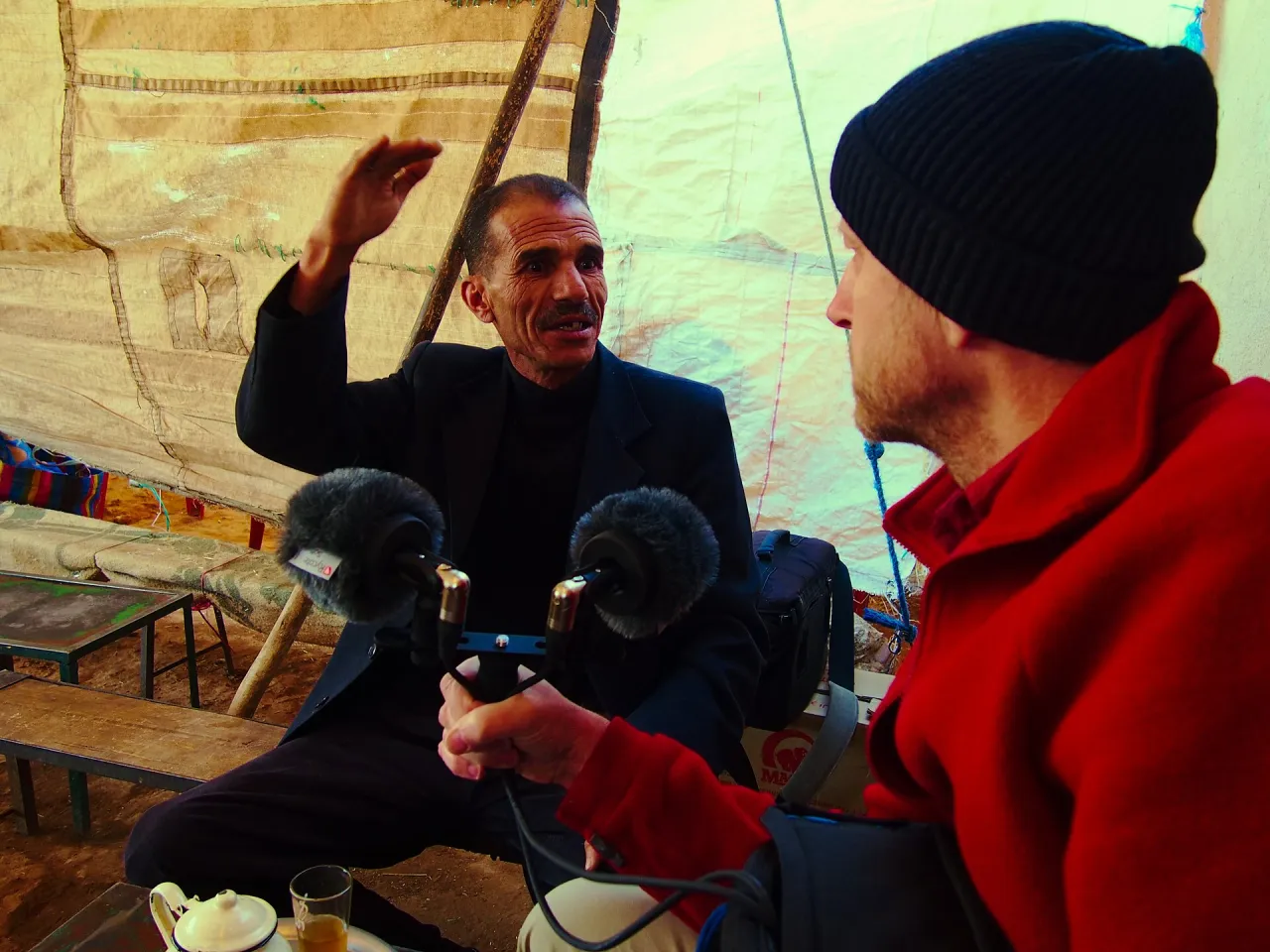 Research interview being conducted in a marketplace