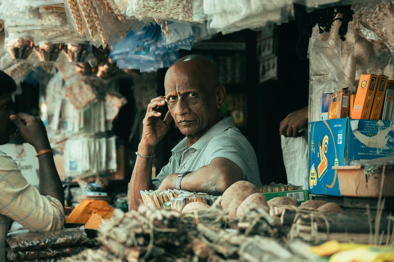 Shopkeeper at a busy retail market
